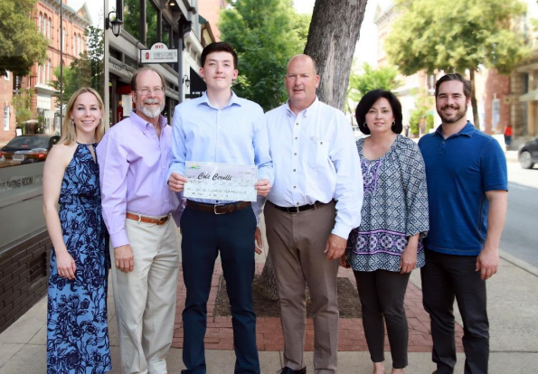 Cole Cerulli (center) during his visit to NaturaLawn of America Corporate Office